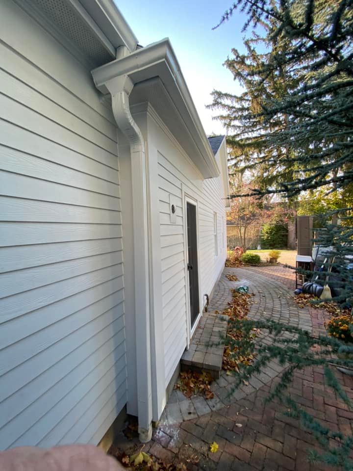 Our professional gutter cleaning service removes debris, leaves, and buildup to ensure water flows freely through your gutters. Prevent damage and maintain the integrity of your home with our thorough cleaning. for KC Custom Exteriors  in Muskegon,  MI