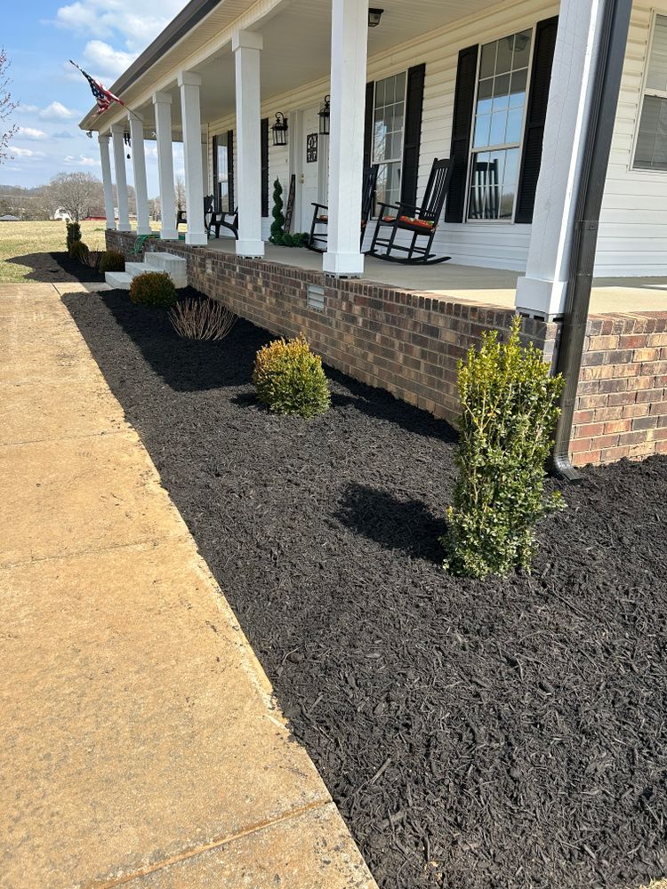 Enhance your home's curb appeal with our professional mulch installation service, providing optimal moisture retention and weed prevention to keep your garden thriving while adding a polished look to your landscape. for MLC in Murfreesboro, TN