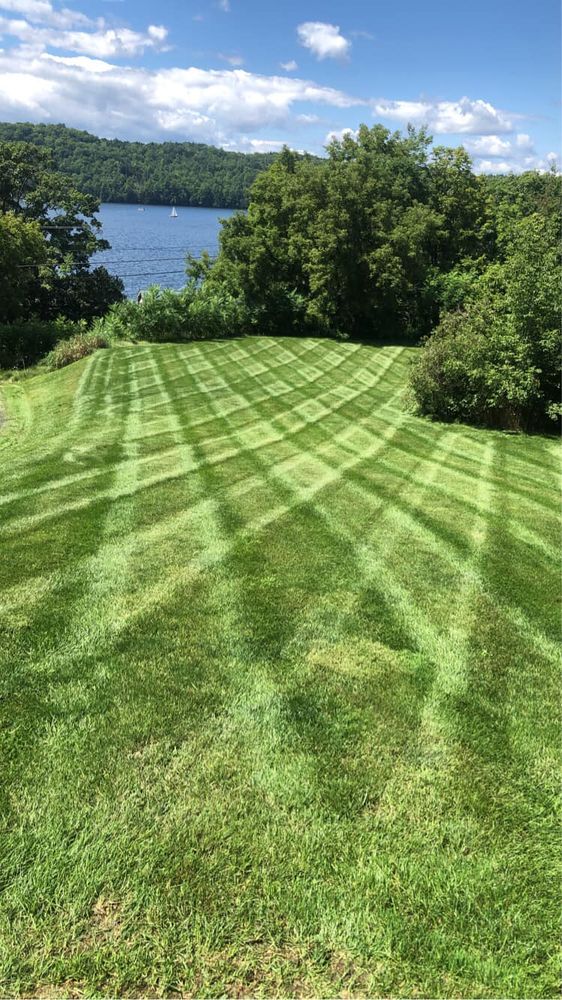 Our Weekly Mowing service ensures your lawn is consistently maintained to perfection with our skilled team using professional equipment, keeping your yard looking lush and pristine all season long. for Levi Allen Lawn Care in Rutland County, VT