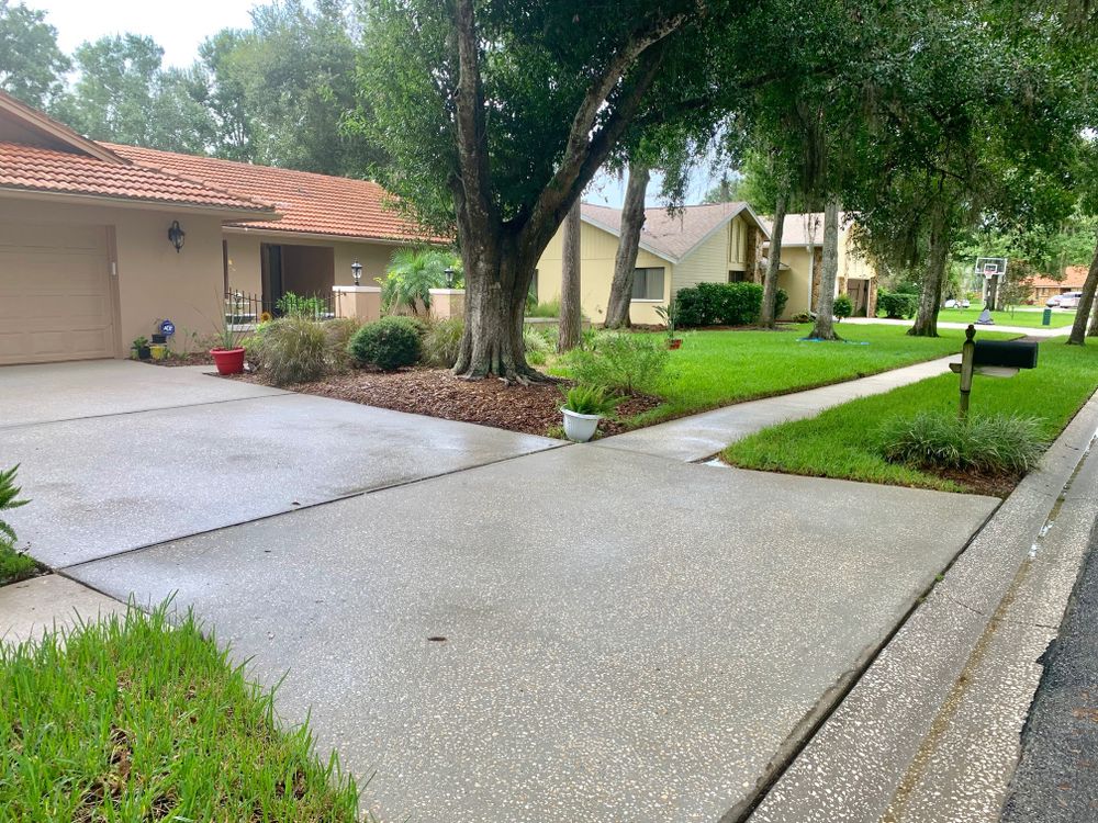 Our driveway and sidewalk cleaning service removes dirt, stains, algae, and grime to instantly improve curb appeal, enhance safety, and restore your home’s exterior surfaces with professional pressure washing. for West Lawn Service LLC in Fort Myers, FL