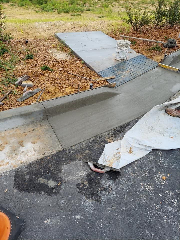 Our Concrete company's Curbs service provides durable and aesthetically pleasing concrete curbs, enhancing curb appeal, ensuring proper drainage, and defining property boundaries with precision for a long-lasting solution tailored to homeowners' needs. for Mid-Florida Short Loads in Pine Hills, FL