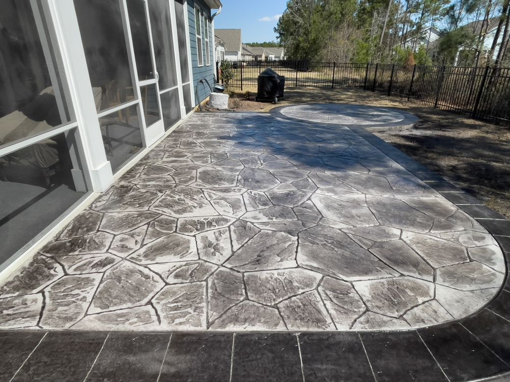 Enhance your home's aesthetic with our stamped concrete service, expertly crafting durable and stylish surfaces that form the foundations of beautiful patios, driveways, and walkways tailored to your unique taste. for Rock Solid Custom Concrete in Wilmington, NC