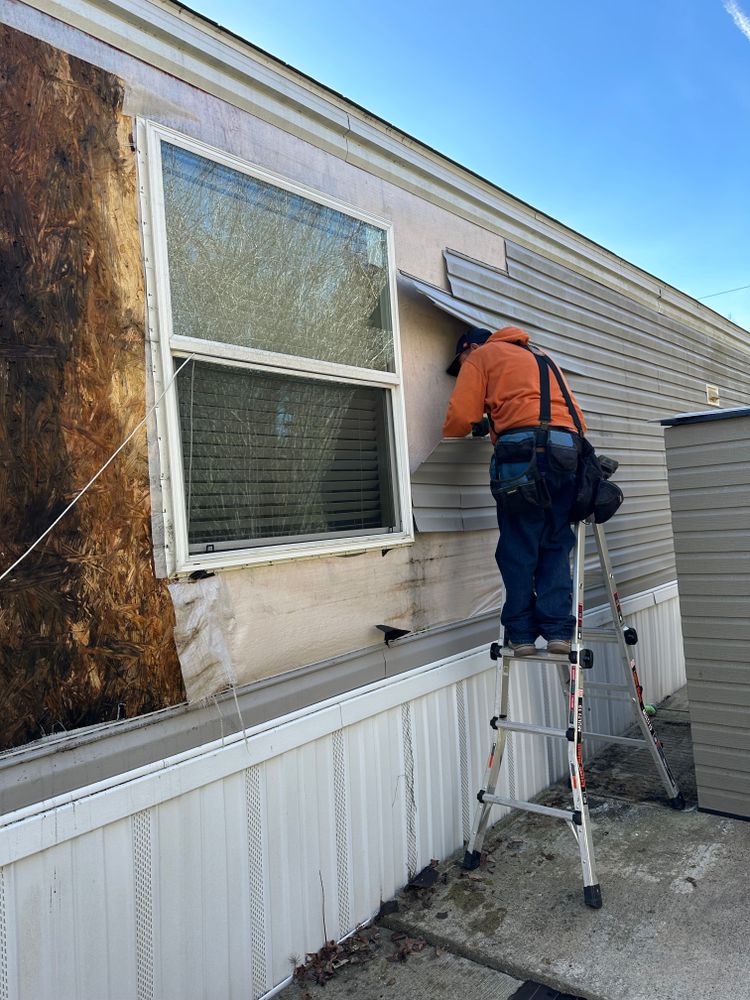 Our expert team offers reliable Vinyl Siding Repairs to enhance your home's curb appeal, ensuring seamless integration with our comprehensive roofing repair services for a complete exterior transformation. for Safe Roofing Inc in Jacksonville, NC