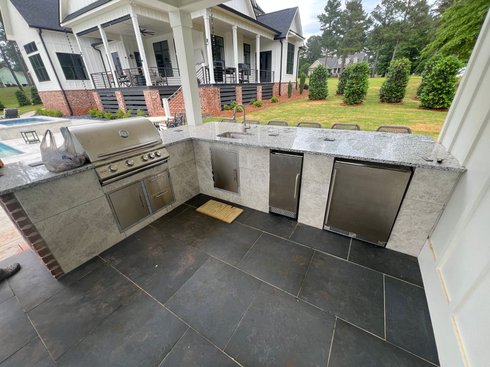 Transform your backyard with our outdoor kitchen design service, expertly crafted to enhance functionality and style. Trust our carpentry company for personalized solutions that elevate your outdoor cooking experience. for Arrowhead Property Solutions in Fort Valley, GA