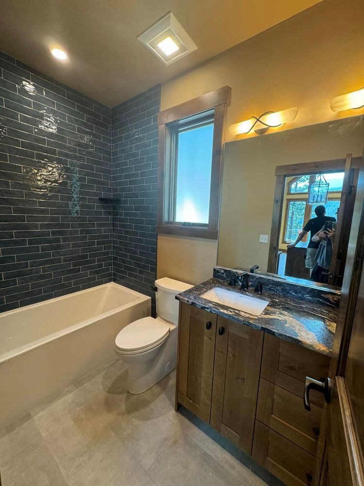 Transform your bathroom into a modern oasis with our expert renovation services, featuring high-quality materials and skilled craftsmanship to enhance style, functionality, and comfort in your home. for Holden Custom Homes in Kalispell, MT