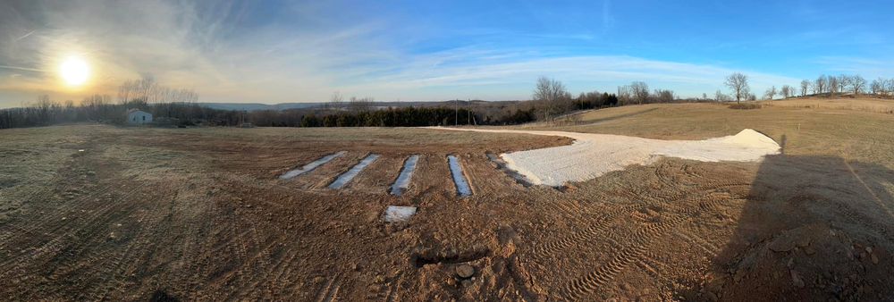 Enhance your home's curb appeal with our professional driveway construction service, offering durable and aesthetically pleasing solutions that complement our septic expertise for a seamlessly integrated property improvement experience. for Boyd Septic & Utility LLC in West Fork, AR