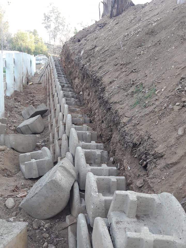 Enhance your outdoor space with our expert retaining wall construction, providing both functionality and aesthetic appeal to prevent soil erosion while seamlessly integrating into your landscape design. for Best Lawncare in Colton, CA