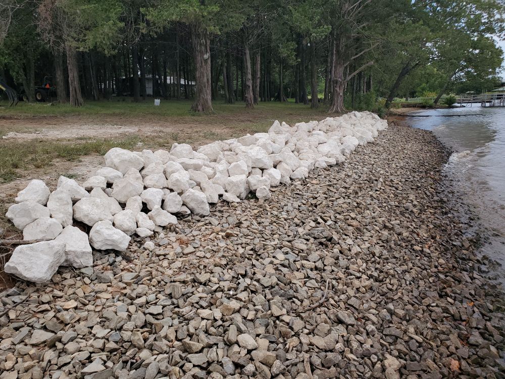 Losing your shoreline to erosion? We build the toughest riprap shorelines. for Honey Do Dirt Works in Bonham, TX