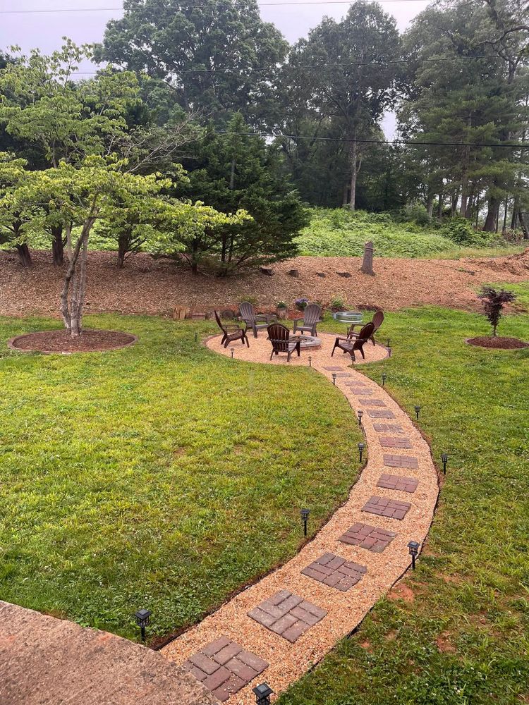 Enhance your home's beauty with our Outdoor Space Design and Maintenance service, offering expert landscaping solutions, meticulous care for trees and plants, and personalized designs that transform your outdoor areas into stunning retreats. for Torres Tree Service and Landscaping in Hendersonville, NC
