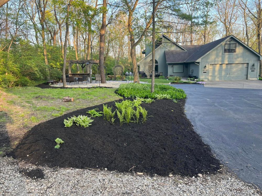 Our mulching service refreshes your landscape with clean, protective ground cover that retains moisture, reduces weeds, improves soil health, and enhances curb appeal for a polished, low-maintenance outdoor space year-round. for K.R. Wessling Outdoor Services in Miamisburg, OH