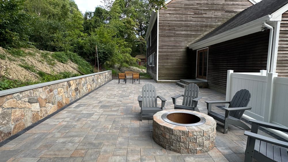 Enhance your outdoor living space with our expert patio design & construction service, providing custom layouts and quality craftsmanship tailored to transform your backyard into a stylish and functional retreat. for Greenscaping & Masonry LLC in Bethel, CT