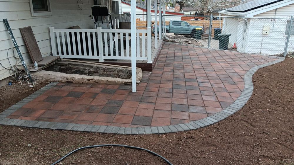 Transform your outdoor space with our expert Patio Design & Construction service, offering customized solutions to enhance aesthetics and functionality, ensuring a beautiful and enjoyable area for relaxation and entertainment. for Double A Home & Lawn Services in Montrose, CO