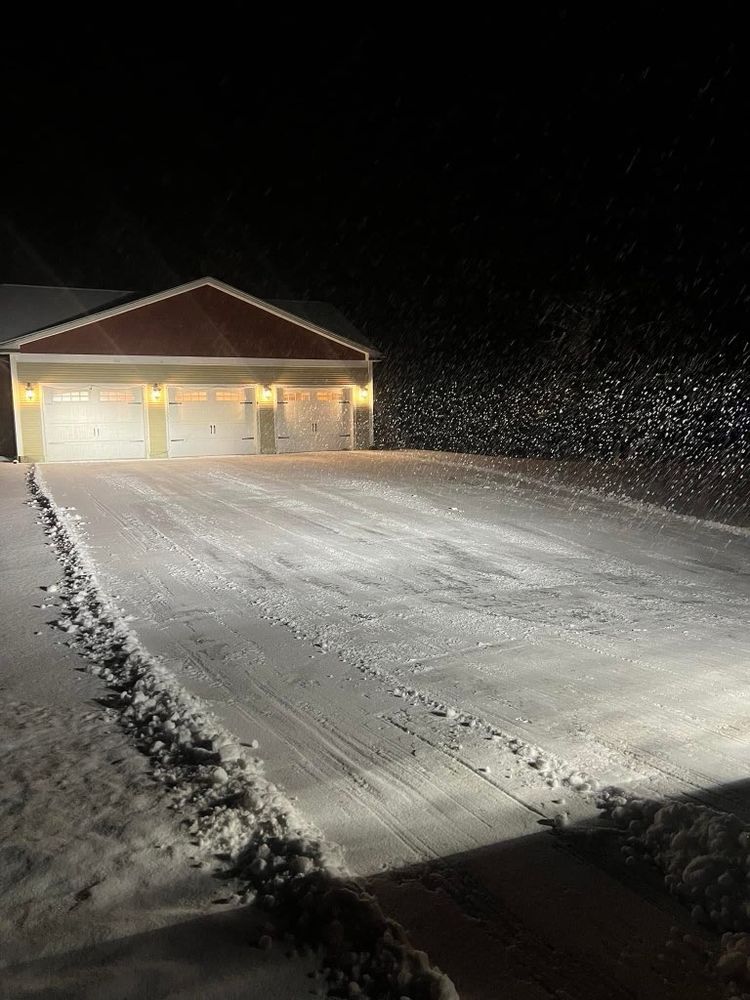 Our Snow Plowing and Removal service ensures your driveway, sidewalks, and pathways are clear, safe, and accessible throughout the winter season with prompt, reliable service tailored to your home's needs. for Bishop’s Property Maintenance in Franklin, VT