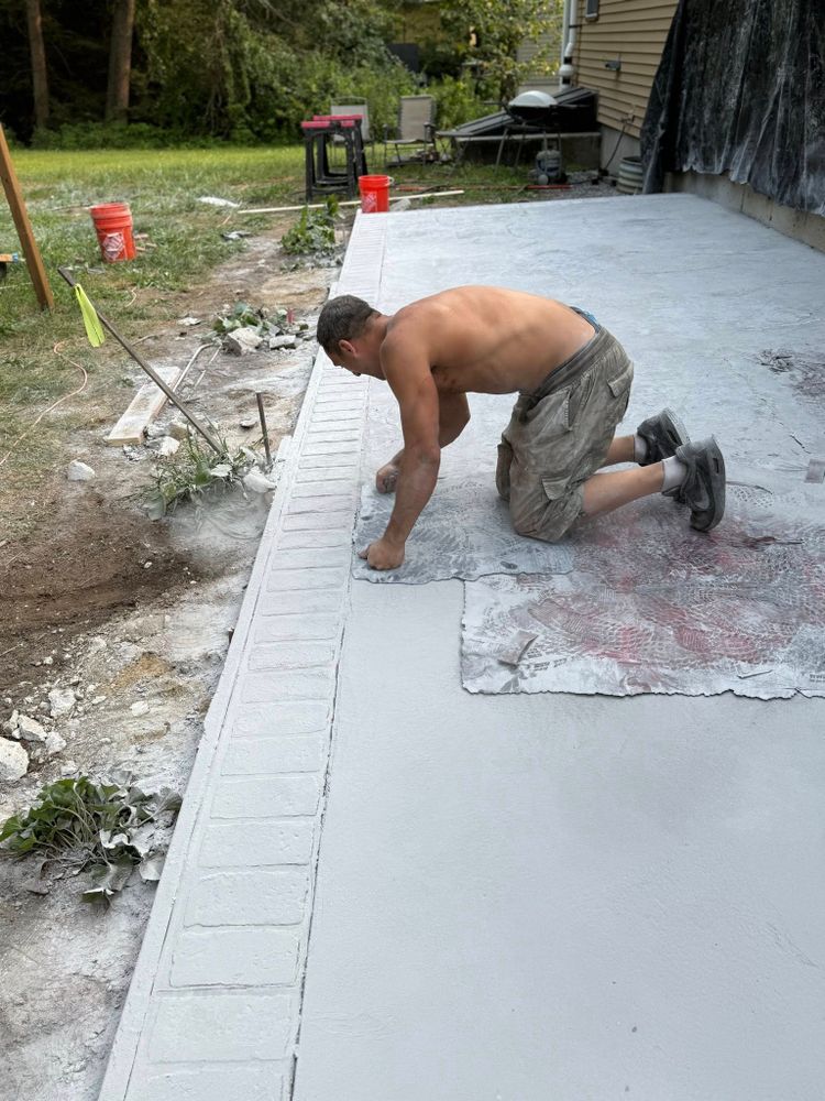 Transform your outdoor spaces with our Stamped Concrete Installation service, offering durable, visually appealing solutions that mimic natural textures and add elegance to patios, driveways, and walkways. Quality craftsmanship guaranteed. for Custom Concrete of Maine in Biddeford, ME