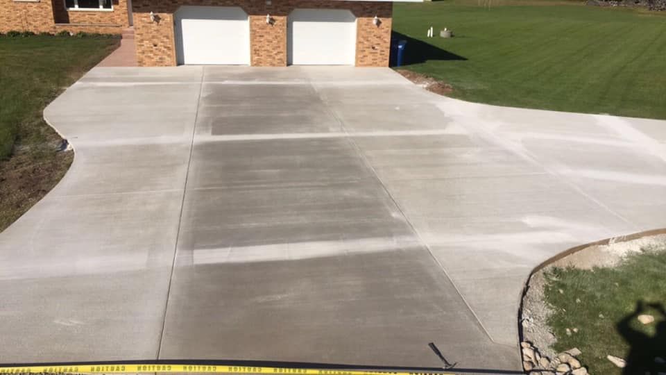 Transform your home's entrance with our expert concrete driveways installation. Durable, stylish, and customized to fit any design preference, our service ensures a lasting first impression for any property. for Rasmussen Concrete in Appleton, WI