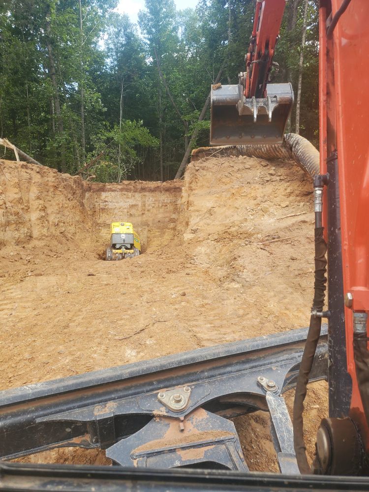 Our Residential & Commercial Excavation service efficiently handles site preparation, grading, and trenching projects with precision and care, ensuring a solid foundation for your construction needs while prioritizing safety and professionalism. for Jason Scott Grading & Clearing in Williamson, GA