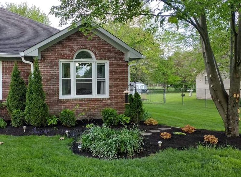 Our Mulch Installation service provides a cost-effective and visually appealing solution to improve the health of your landscaping. Enhance curb appeal, retain moisture, reduce weed growth and protect plant roots. for Bearforce Lawn Care LLC in Greenfield, IN