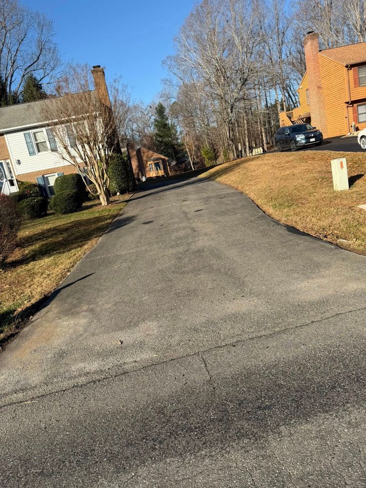 Transform your home's curb appeal with our residential paving service, offering durable and aesthetically pleasing driveways and pathways using premium asphalt materials for long-lasting beauty and functionality. for Gus’s Paving and Sealcoating in Lynchburg, VA