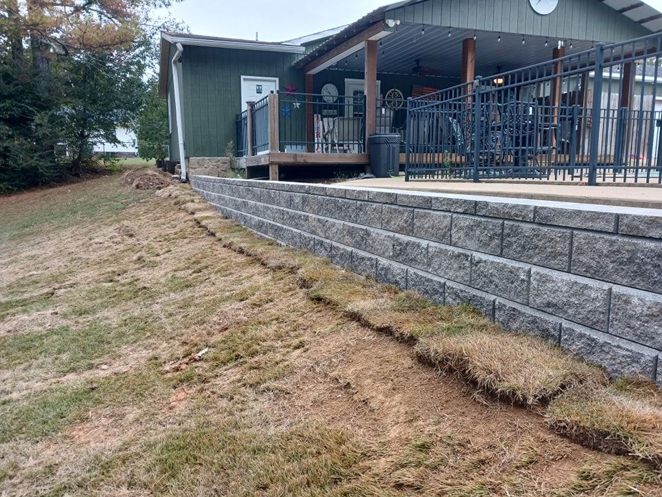 Our Retaining Wall Construction service provides expert design and installation of durable walls that enhance the functionality and aesthetics of your outdoor space, ensuring proper soil retention for long-lasting results. for CODE 3 Landscaping & Lawn Care in  Leoma,  TN