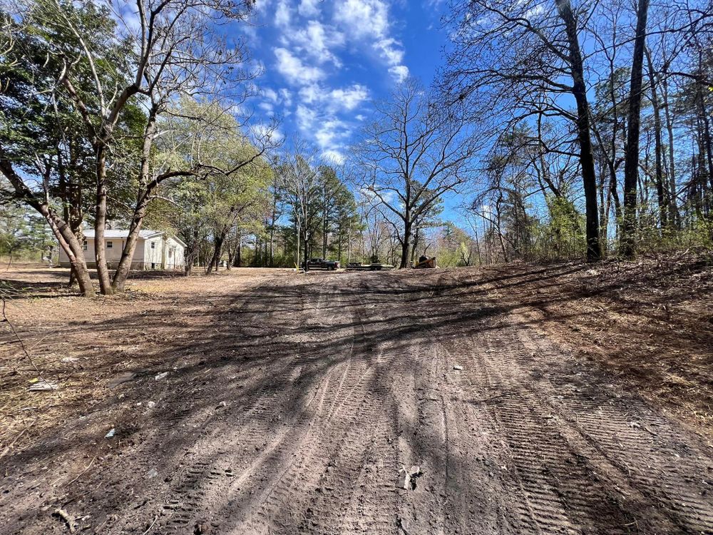 Transform your property with our comprehensive Driveway Construction service, expertly clearing land to create a smooth, durable driveway that enhances accessibility and adds value to your home. for Mud Creek Vegetation Management in Russellville, AL