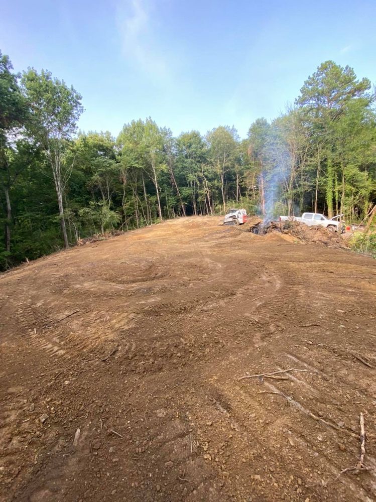 Our Land Clearing service efficiently removes trees, vegetation, and debris to prepare your property for construction or landscaping projects, ensuring a clean slate with minimal environmental impact and maximum safety. for Rocky Top Concrete & Excavating in Knoxville, TN
