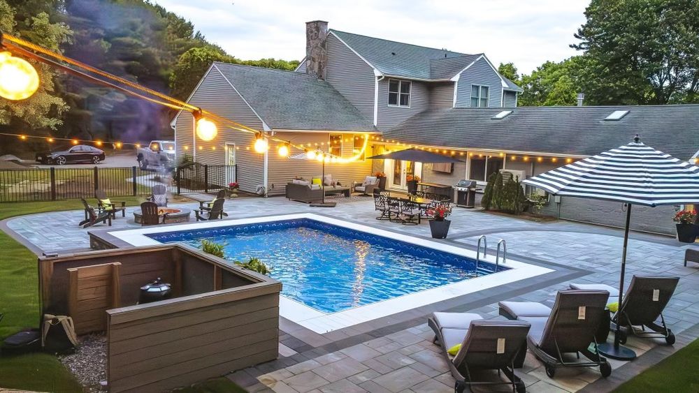 Transform your backyard with our expert swimming pool construction and remodeling services, offering custom designs, high-quality materials, and precise craftsmanship to create a stunning oasis tailored to your home. for Doyle & Sons LLC in Quincy, MA