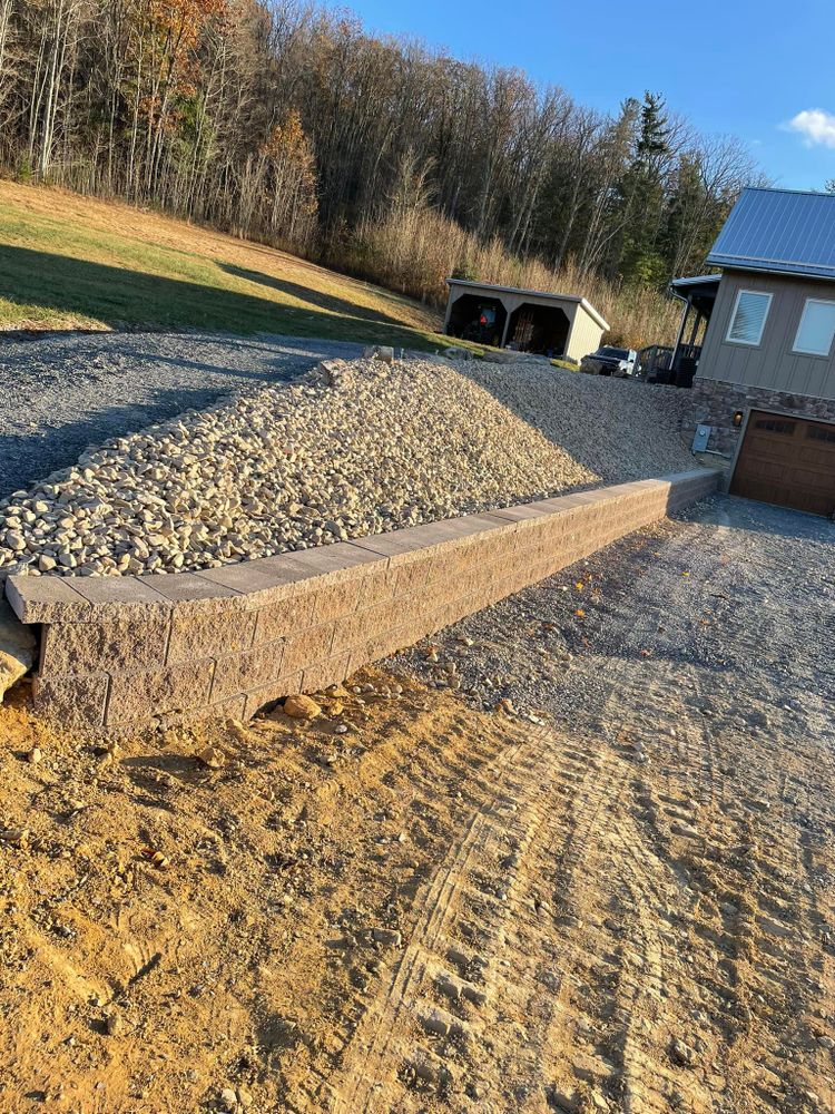 Enhance your outdoor space with our professional retaining wall construction service. We design and build durable, attractive walls that prevent erosion, maximize usable area, and add visual appeal to your landscape. for Horizon Construction in Covington, VA