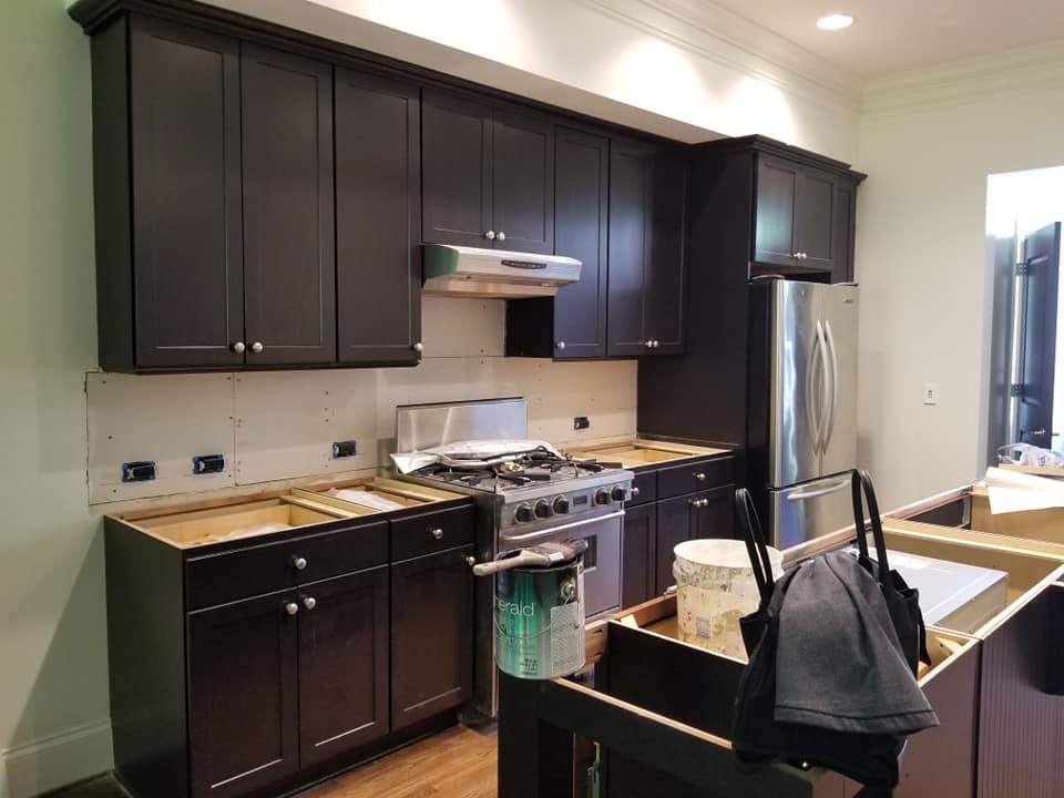 Revitalize your kitchen with our expert cabinet refinishing service. We transform worn cabinets into stunning focal points, enhancing aesthetics and value while saving you the cost of complete replacements. for National Painting & Drywall LLC in Lawrenceville, Georgia