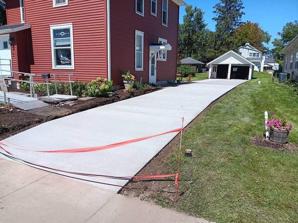 Enhance your home's curb appeal with our expert driveway services. We offer durable, custom-designed driveways that perfectly blend style and functionality, ensuring a smooth finish and long-lasting performance for your property. for Willing Trucking & Excavating in Evansville, WI