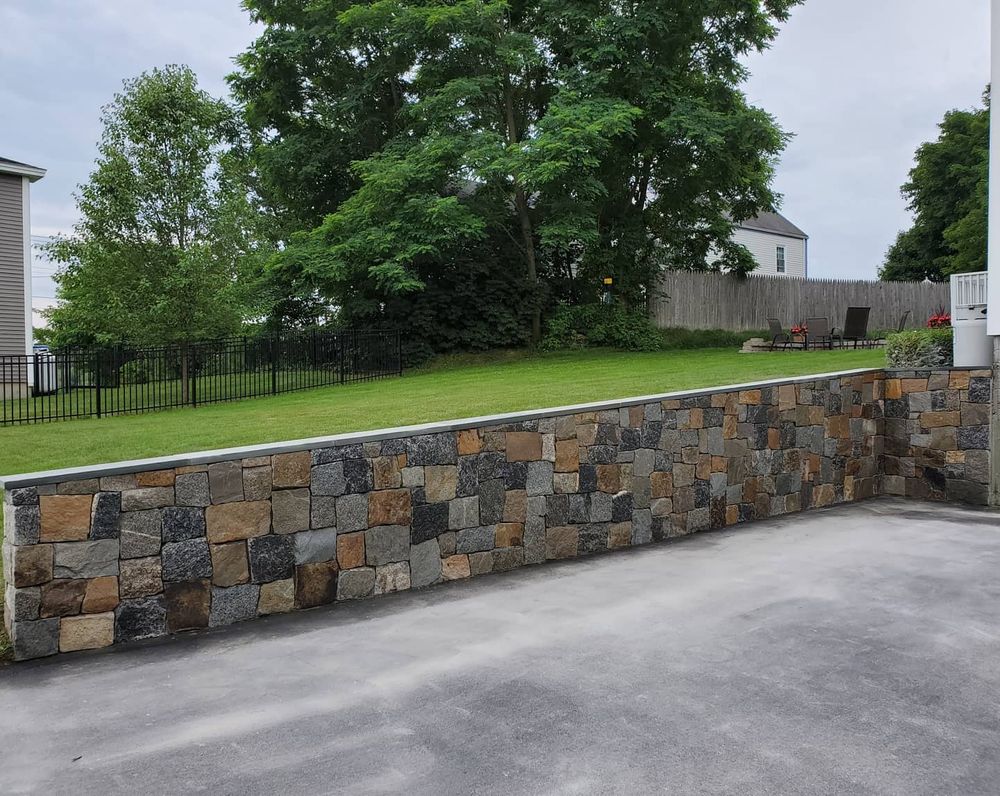 Enhance your property's safety and aesthetics with our expert retaining wall construction service, providing durable, custom-made solutions to prevent soil erosion while adding significant value and visual appeal to your landscape. for 207 Stonework in Kennebunkport, ME