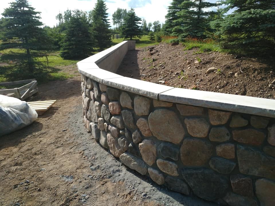 Our expert team constructs durable and visually appealing retaining walls tailored to your landscape needs. Enhance the functionality and aesthetics of your outdoor space with our professional construction service. for North Shore Concrete & Masonry in Duluth, MN