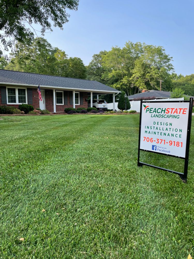 Our Lawn Maintenance services provide regular mowing, trimming, and weed control to keep your yard looking pristine year-round. Let us take the hassle out of lawn care for you! Contact us today about our 12-month lawn maintenance programs. for Peach State Landscaping in Hartwell, GA