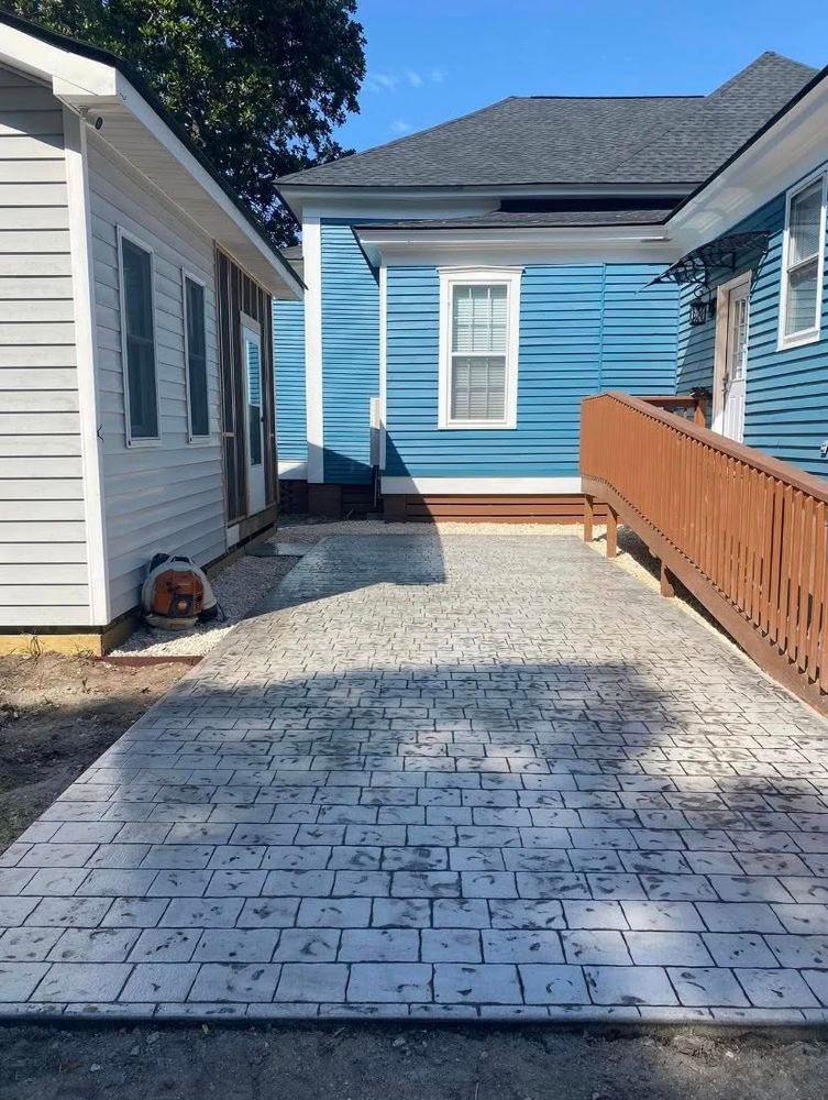 Transform your outdoor spaces with our professional stamped concrete installation service, offering beautiful, durable designs that mimic high-end materials. Enhance your home’s curb appeal and value with minimal maintenance required. for Big League Concrete and Grading in Batesburg-Leesville, SC