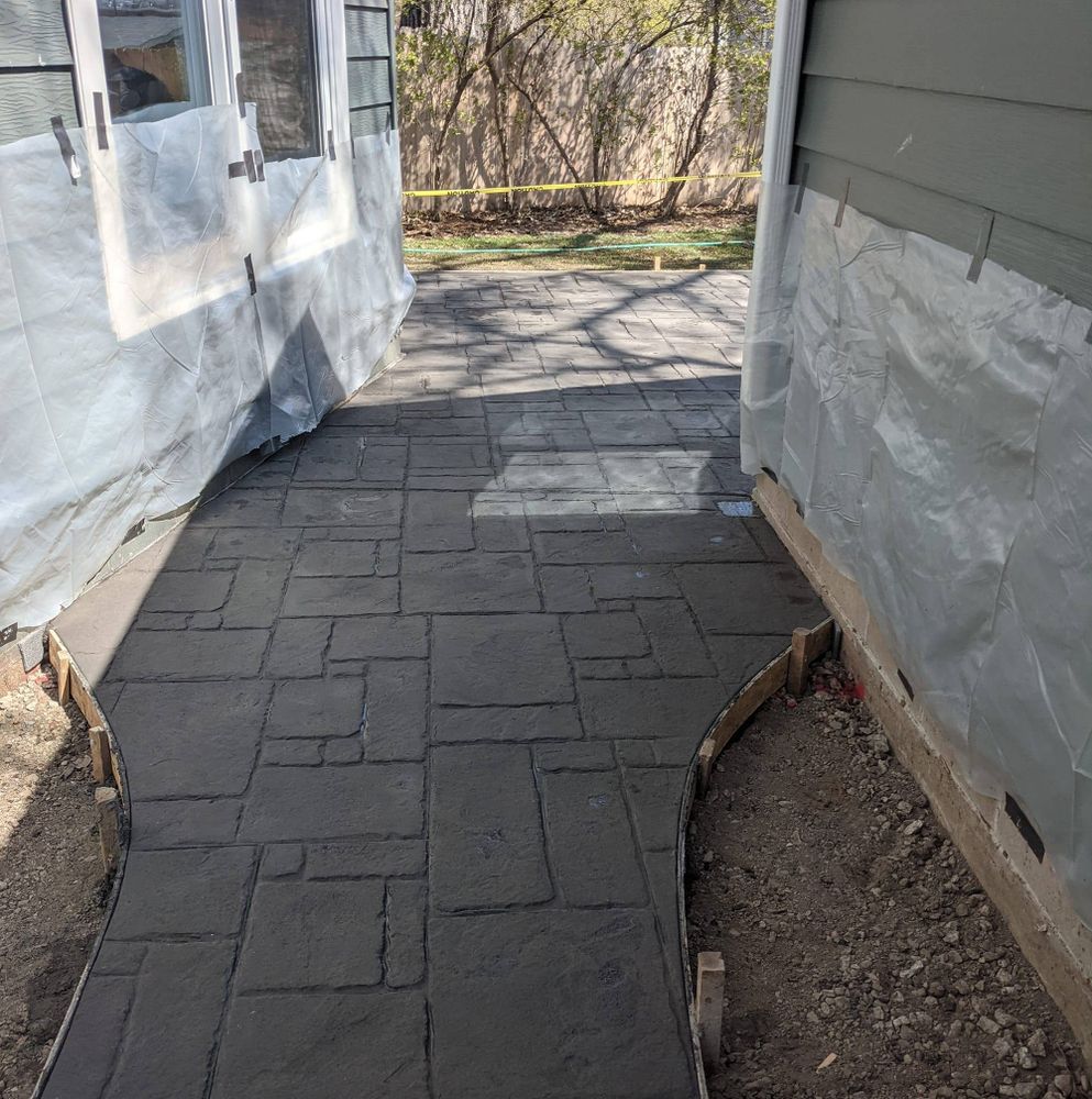 Enhance your outdoor space with our professional stamped concrete installation service, offering durable, stylish surfaces that mimic natural textures while providing the durability and easy maintenance of concrete for lasting beauty. for Six Diamonds Concrete in Mounds View, MN