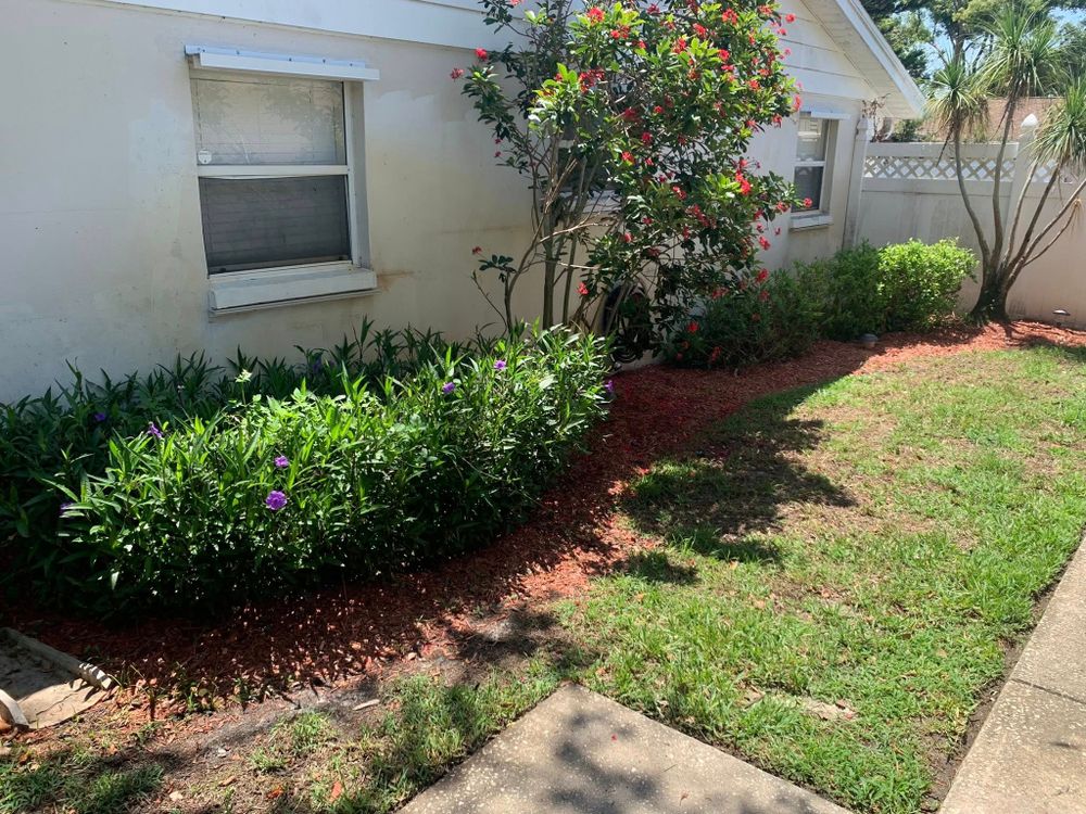 Enhance your garden's health and appearance with our professional mulching service, utilizing a top-of-the-line mulching mower to recycle grass clippings into nutrient-rich fertilizer for vibrant, lush lawns year-round. for Mitchell Lawn Service in Odessa, FL
