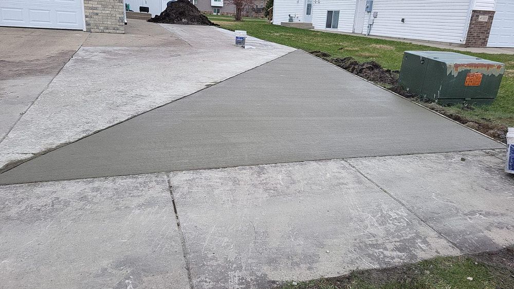 Our Concrete Repair service revitalizes and strengthens your existing surfaces, ensuring durability, safety, and enhanced appearance for driveways, patios, and walkways while boosting property value with professional care and precision craftsmanship. for Golden Construction in West Fargo, ND