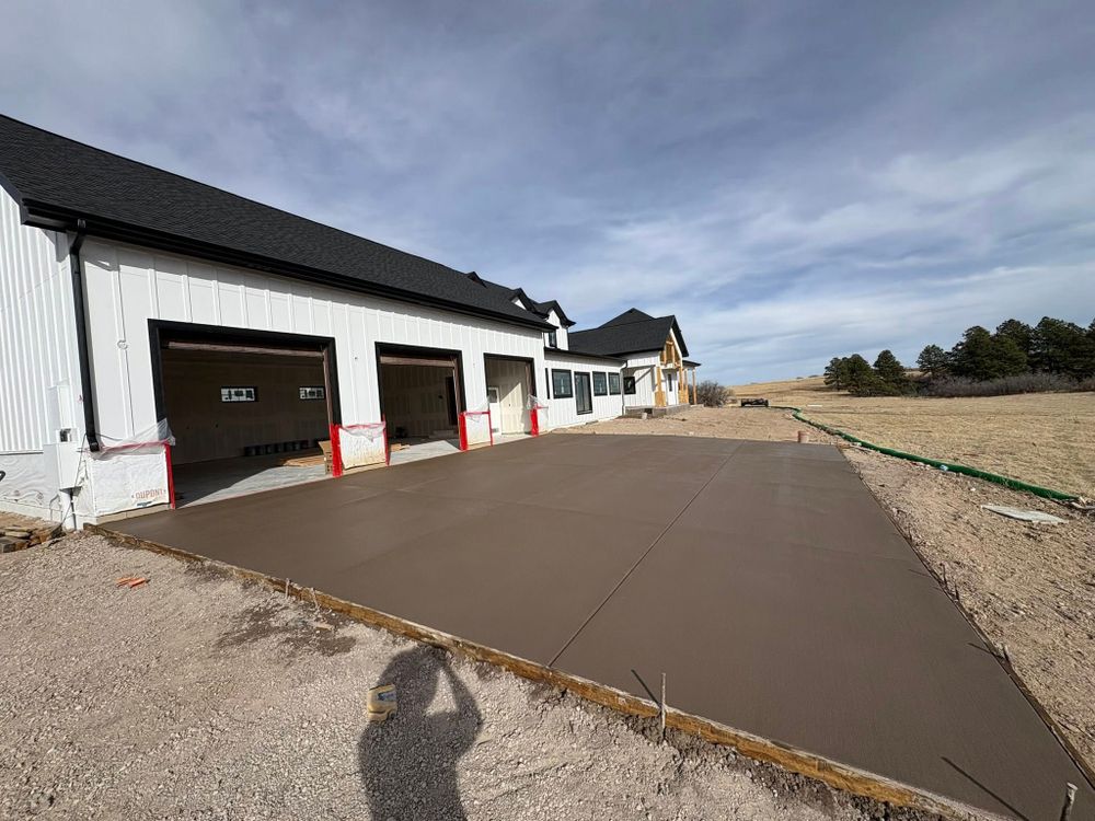 Our flatwork service installs durable, attractive concrete surfaces like driveways, patios, sidewalks, and slabs with expert grading, smooth finishing, and long-lasting performance to enhance your home’s function and curb appeal. for Acorn Construction & Contracting in Colorado Springs, CO