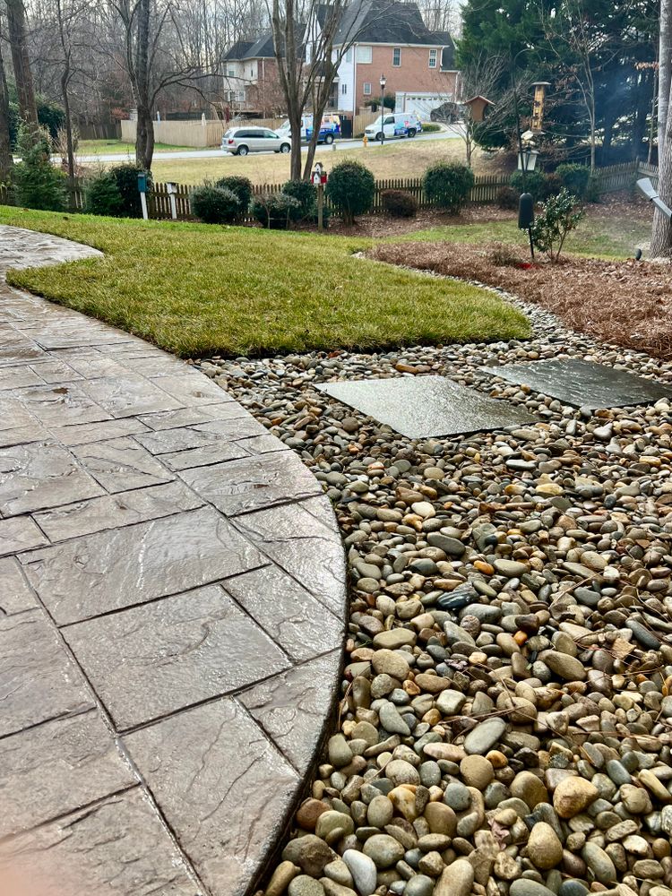 Enhance your landscape with our professional mulch, river rock and pine needle installation services. We provide high-quality mulch, river rock, and pine needles, which will instantly revitalize the overall curb appeal of your property. for Malboeuf Landscaping, Inc in Kernersville, NC