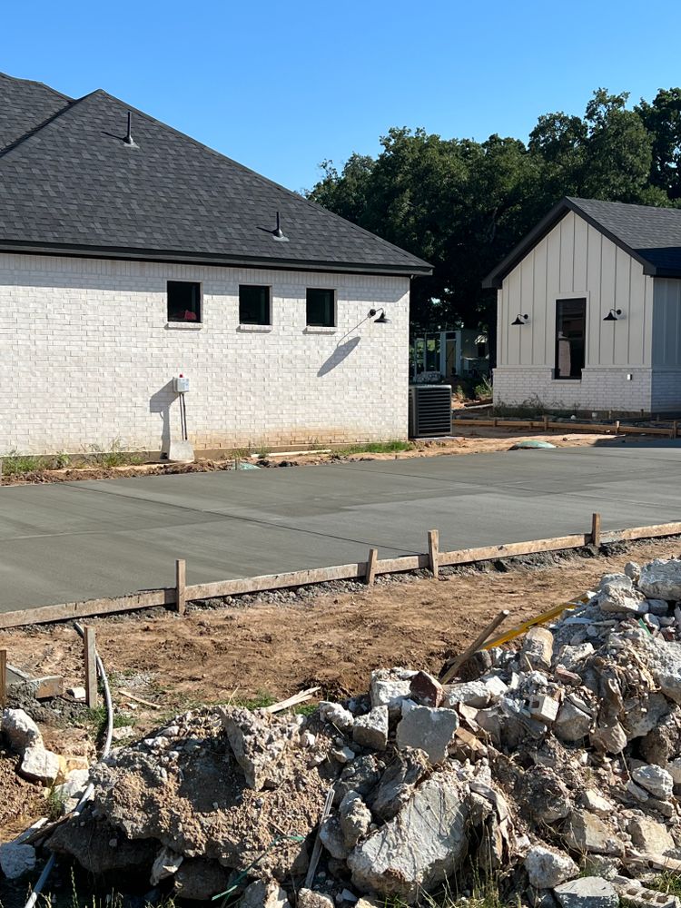 Our Concrete Installation service offers homeowners the durable and versatile option of using "what is concrete" for creating foundations, driveways, walkways, patios, and more for long-lasting structural stability. for Koblis Construction Services in Dallas, TX