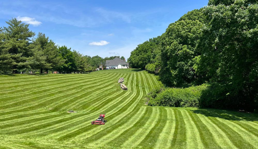 Our professional mowing service ensures your lawn is expertly cared for, maintaining its pristine appearance all season long. Sit back and relax while we handle the hard work for you. for Green Sweep Lawn and Landscape in Eureka, MO