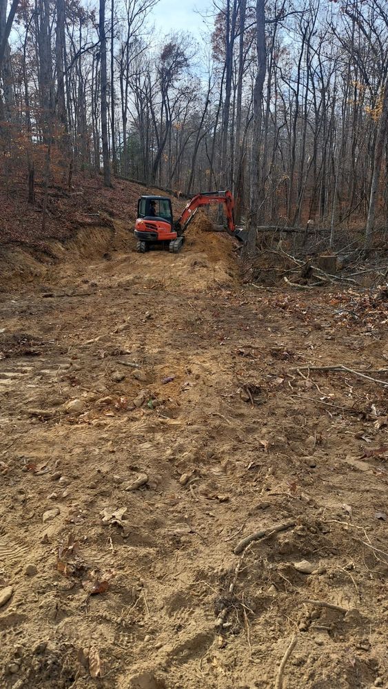 Discover what is land clearing with our expert service, efficiently transforming overgrown properties by removing trees and debris, enhancing space for your dream project while ensuring safety and precision in every demolition. for Troyer's Excavation in Monterey, TN