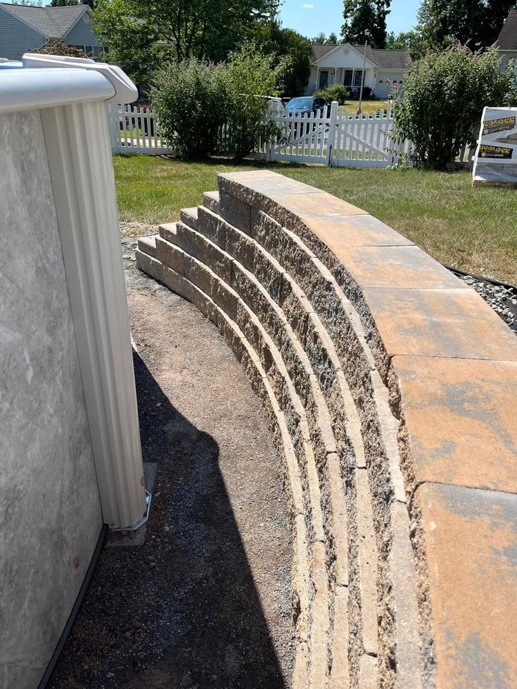 Our retaining wall construction service enhances your landscape by preventing soil erosion, increasing usable space, and adding value to your property with durable, aesthetically pleasing walls designed to suit your needs. for Young’s lawns & landscapes in Thurmont, MD