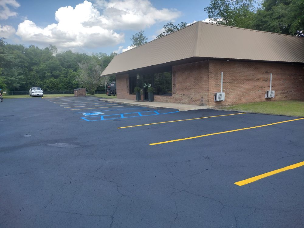 Our Asphalt Parking Lot Construction service provides durable and aesthetically pleasing surfaces, ensuring smooth installation and long-lasting results for homeowners seeking reliable solutions to enhance their property's functionality and curb appeal. for Under Pressure Seal Coating and Lot Striping in Colquitt County, GA