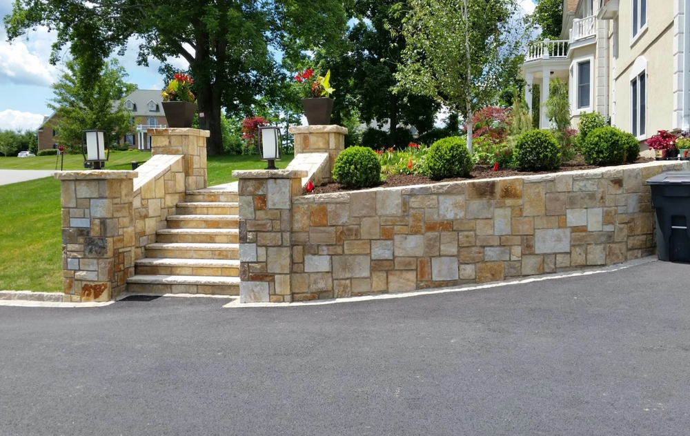 Our Retaining Wall installation service provides homeowners with expert masonry solutions, helping to prevent soil erosion and create functional outdoor spaces while adding aesthetic appeal to their property. for Arrowhead Masonry LLC  in Washington County, RI