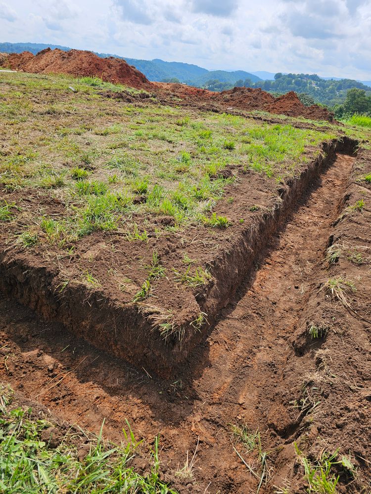 Our Footings service ensures a solid foundation for your home, meticulously preparing the ground to support structural stability and prevent future issues, making your building project safe and reliable. for Walker Excavation in Tazewell, TN