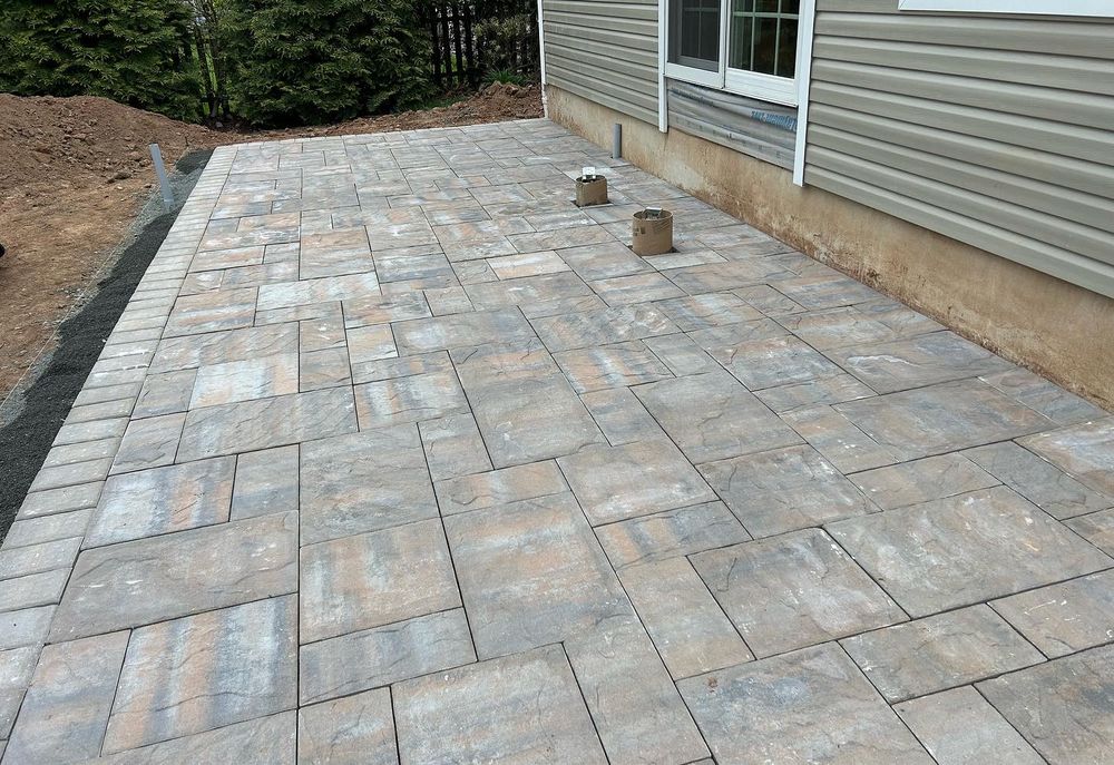 Enhance your outdoor living space with our expert Patio Design & Construction services, offering customized layouts and quality craftsmanship to transform your backyard into a beautiful, functional retreat you'll love. for Garciano Masonry in Springfield Township, NJ