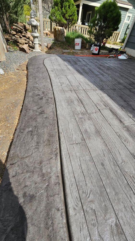 Enhance your outdoor space with our professional stamped concrete installation, offering durability and elegance. Our expert team transforms patios and driveways into stunning designs that add value to your home. for Gemini Construction & Excavating LLC in Evans, CO