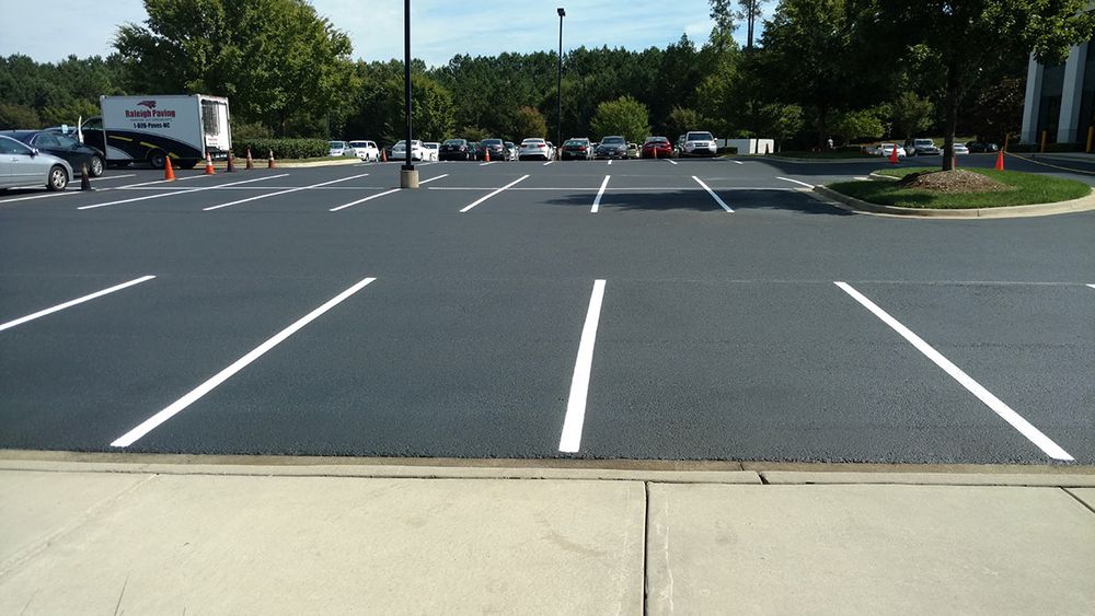 In addition to our exceptional sealcoating services, we also offer a range of other services such as crack filling, line striping, and asphalt repairs to meet all your paving needs. for Black Diamond Sealcoating in St. Charles, IL