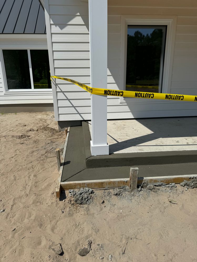 Our Concrete Slab Construction service offers homeowners a durable and cost-effective solution for creating stable foundations, driveways, patios, and more through expert excavation and precise installation techniques. for Davis Contracting & Site Work in Adams Run, SC