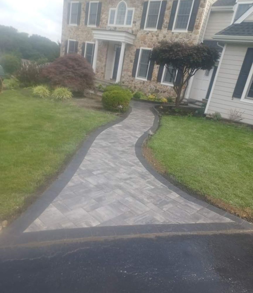 Our Walkways service offers expert masonry solutions to homeowners, creating beautiful and durable walkways that enhance the aesthetics and functionality of your outdoor space. for Arrowhead Masonry LLC  in Washington County, RI